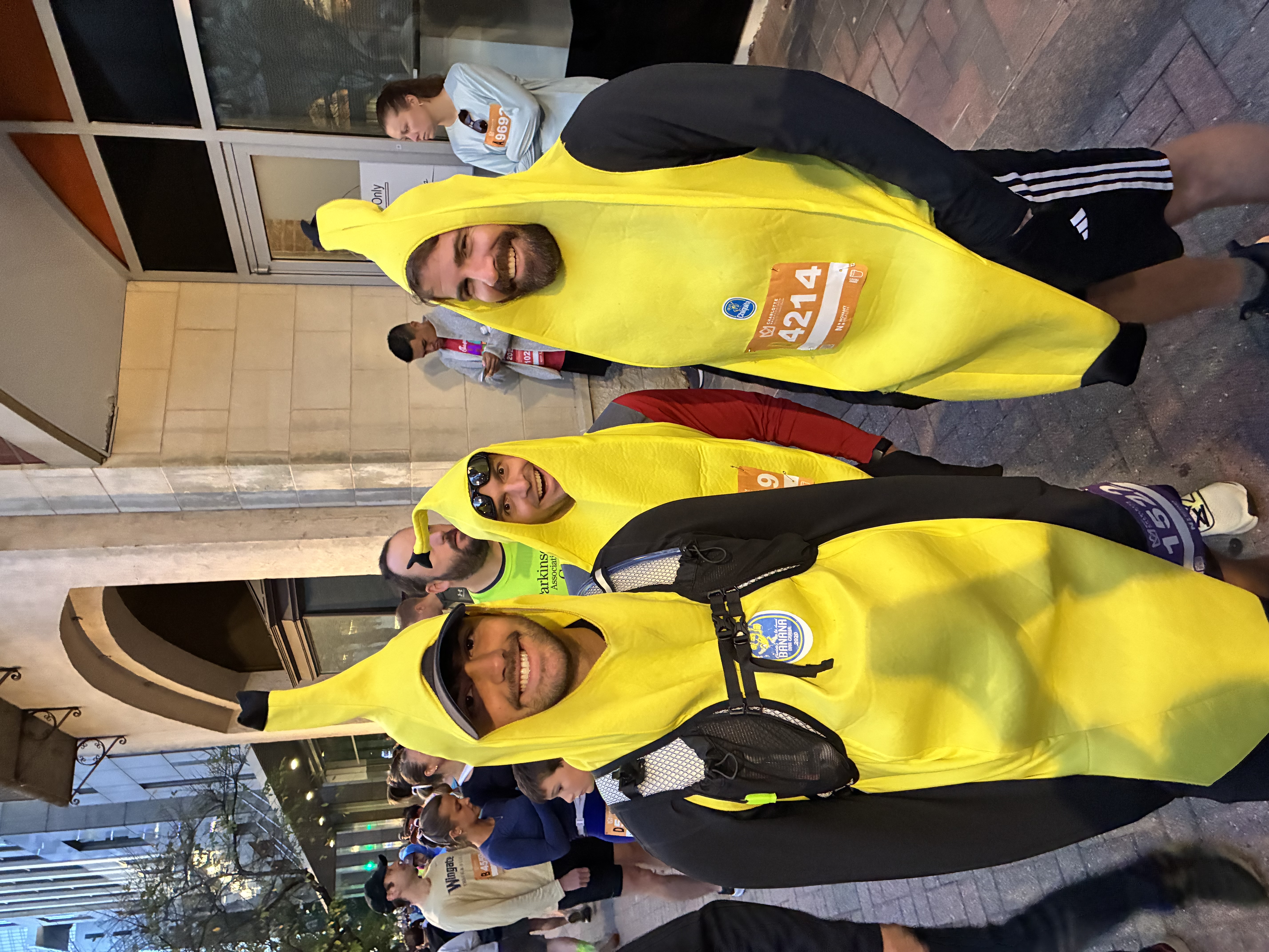 Three runners in banana costumes before the marathon start